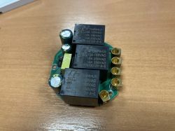 Close-up view of a PCB with three relays and connectors.