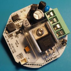 Electronic Module with Components Electronic module with green connector and various components.