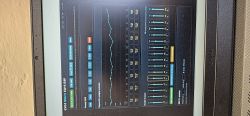 Dell laptop screen showing EVO4 MULTI Entertainment DSP interface with a line graph and multiple sliders