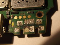 Niezależna ekspertyza uszkodzenia portu USB w Nokia E7-00 po serwisie Regenersis