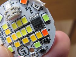 Colorful LED Strip with Electronic Components Close-up of a colorful LED strip with visible diodes and electronic components.