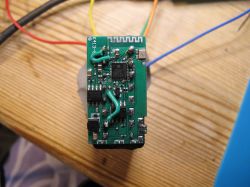 Printed circuit board with soldered wires and marking K413-E.