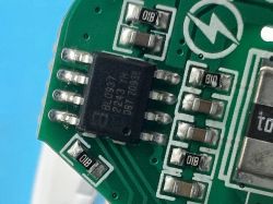 Close-up of BL0937 chip on green PCB with SMD components