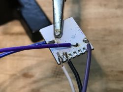 PCB with soldered wires.