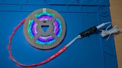 5m RGBIC LED strip with controller laid on a blue mat.