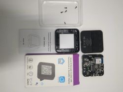 Disassembled digital thermometer with IR remote control and humidity sensor.