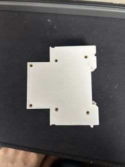 Back Part of Circuit Breaker Casing Rear view of a white electrical device casing with mounting screws.