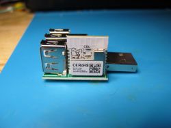 CBU module with three USB ports on a blue background.