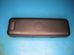 Portable digital voice recorder on blue background Black plastic voice recorder lying on a blue surface