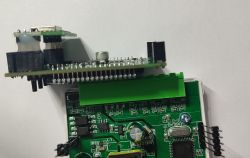 Close-up of a PCB with electronic components and pin headers