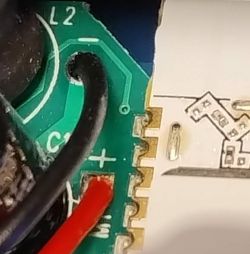 Close-up of a circuit board with connected cables.