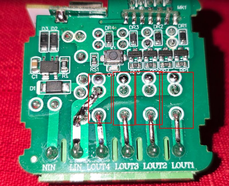 Electronic circuit board with various components, such as resistors and diodes.