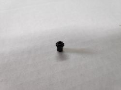 Playstation 4 - Gdzie umieścić wypadłą zębatkę z napędu płyt?