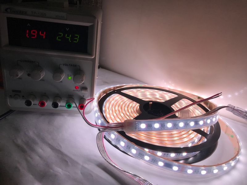 RGBW LED Strip HR00-C24RGBW512AC4-60 with TM512C4 Controllers Close-up of a five-meter RGBW LED strip HR00-C24RGBW512AC4-60 with TM512C4 control modules every six LEDs.