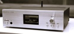 Media player with a front panel display and several control buttons.