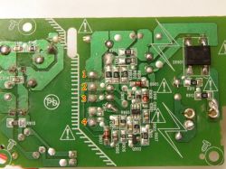 The image shows a close-up of a circuit board with numbers 1, 2, 3, and 4 marked on circuit components.