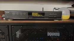 Diora AS 502 tuner with updated display on a wooden shelf