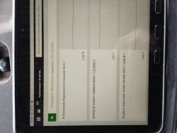 Ekran tabletu z danymi OBD: korekta paliwa 2,34% oraz napięcia sond lambda 0,83 V i 3,40 V