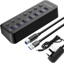 Seven-port USB hub with cables and power adapter.