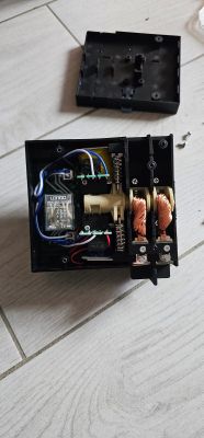 Disassembled electromagnetic relay with coils and visible wiring