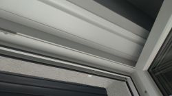 How do I open the roller shutter revision?
