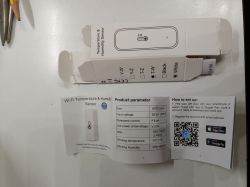 Box and leaflet for a Wi‑Fi temperature and humidity sensor with specs table and a QR setup code