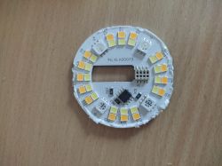 Inside of ExtraStar A60WIFI-2 Smart Bulb Close-up of the internal components of a disassembled ExtraStar A60WIFI-2 smart light bulb, showing wires and PCB.