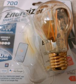Energizer E27 LED Bulb Energizer E27 LED bulb in front of its packaging.