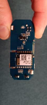 Image of an electronic module held in a hand.