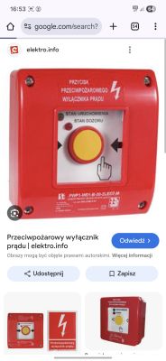 Czerwony przycisk przeciwpożarowego wyłącznika prądu z żółtym środkiem