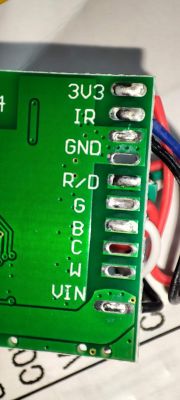 Printed Circuit Board Pins on RGB Controller WX300P Close-up of a printed circuit board with labeled pins such as 3V3, IR, GND.