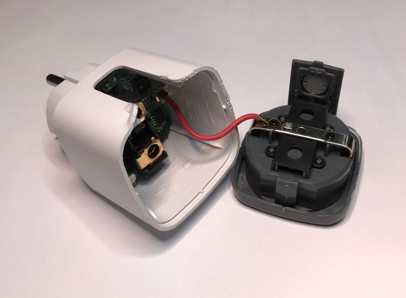 Disassembled Electrical Plug Disassembled electrical plug with visible internal components.