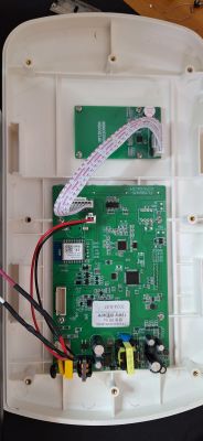 Interior of EV Charger with Electronic Components Interior of an opened EV charger with visible electronic components.