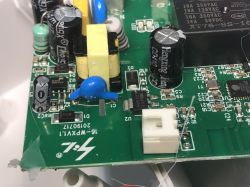 Close-up of the ATLO-S1IP5-TUYA outlet PCB, showing capacitors, relay, ESP8285 chip, and board markings.