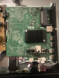 TV mainboard with VESTEL 17MB170E chip, HDMI, USB, LAN, and RF connectors visible.