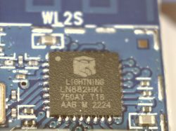 Close-up of an integrated circuit marked LIGHTNING LN882HKI on a printed circuit board.