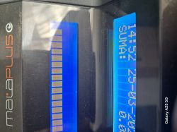 Display of an electronic device with a blue screen and horizontal graphics.