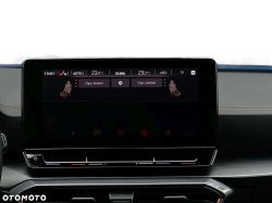 Car infotainment screen showing climate menu and seat heating options, set to 23.0°C