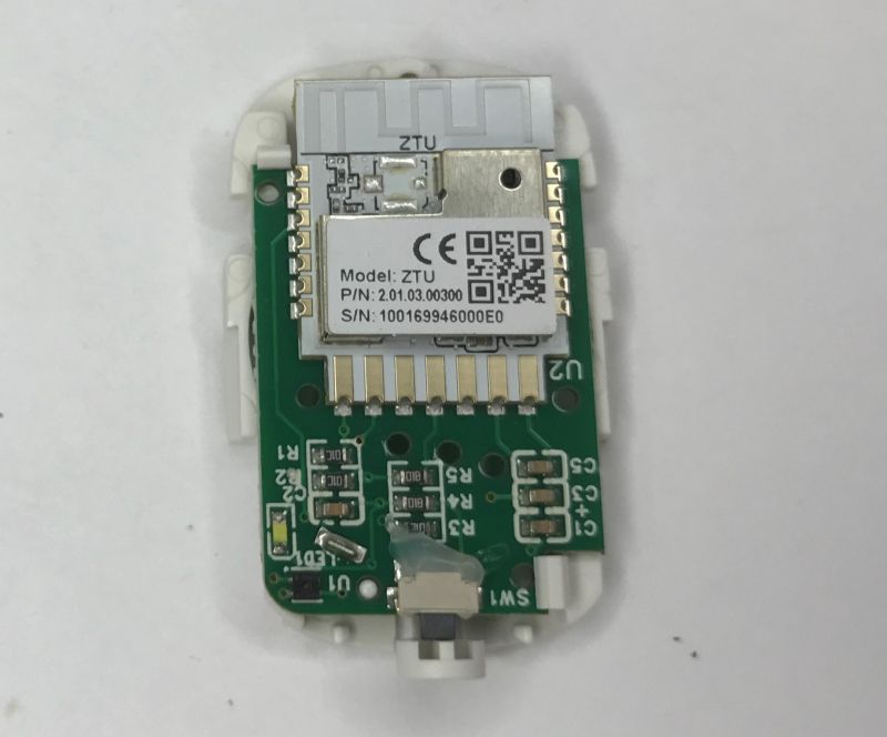 Inside a Zigbee sensor: PCB with ZTU radio module, QR code label, and SMD components