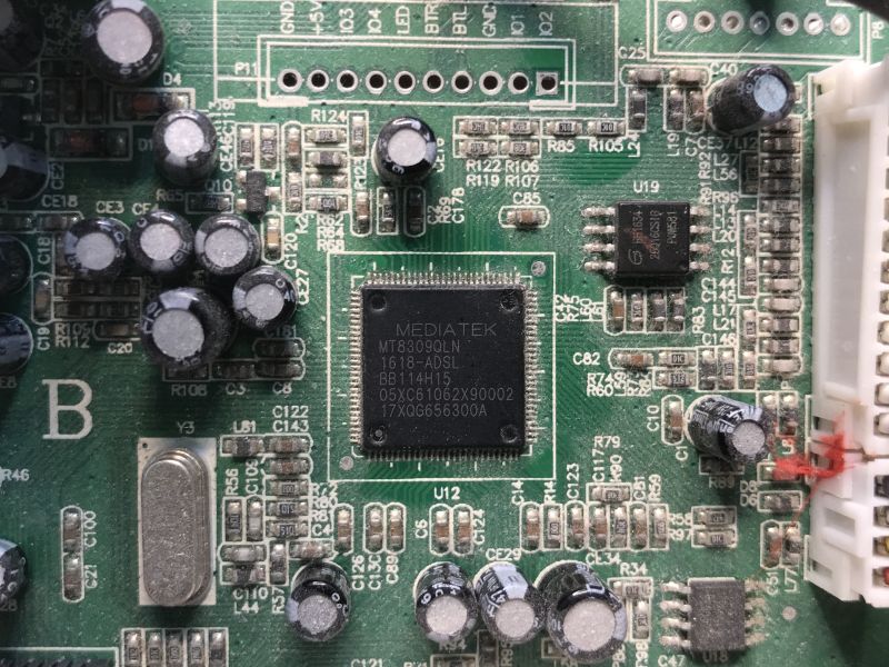 Close-up of PCB with Mediatek MT8309QLN chip and SMD components visible.