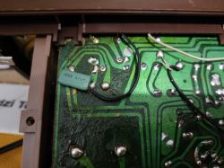 Printed circuit board with a 0.47uF 100V capacitor soldered on the paths