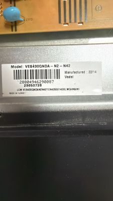 Barcode label on a metal housing showing model VES430QNDA‑N2‑N42 and Vestel.