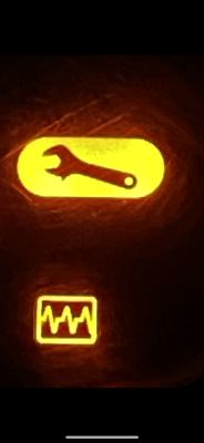 Warning lights on a Renault Fluence car dashboard.