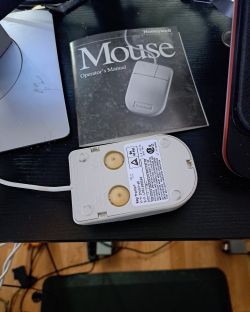 Bottom of KeyTronic Lifetime computer mouse with two rubber feet instead of a ball.