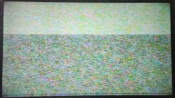 TV screen displaying colorful dots.