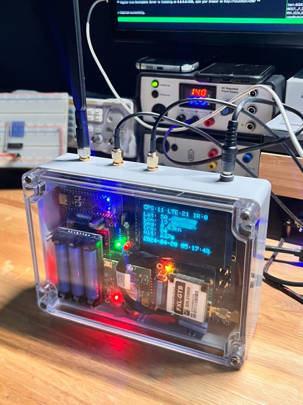GPS Device Prototype with LTE and Iridium GPS prototype with LTE and Iridium communication in a transparent case with an OLED display.