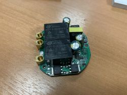 Image of a round printed circuit board with electronic components, including JIEYING relays.