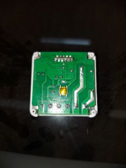 Tuya Mini Smart Switch Circuit Board Photo of the circuit board inside the Tuya Mini Smart Switch with a visible yellow component in the center.