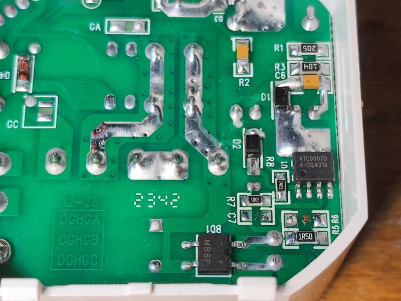 Close-up of a power PCB showing ATC9307B IC, wide soldered traces, and SMD components