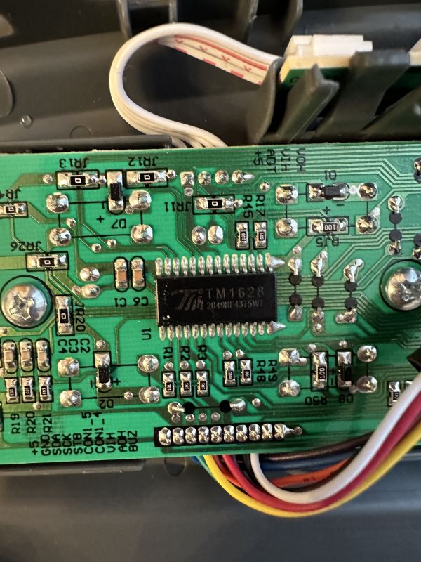 Circuit board with TM1628 integrated circuit.